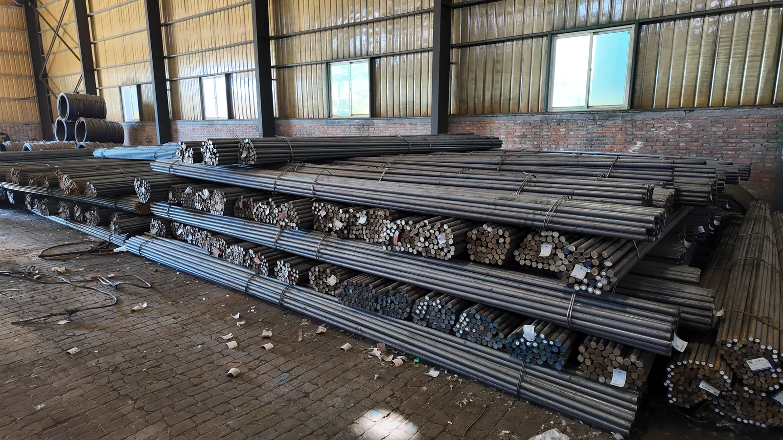 Bundled metal bars stored in a production workshop